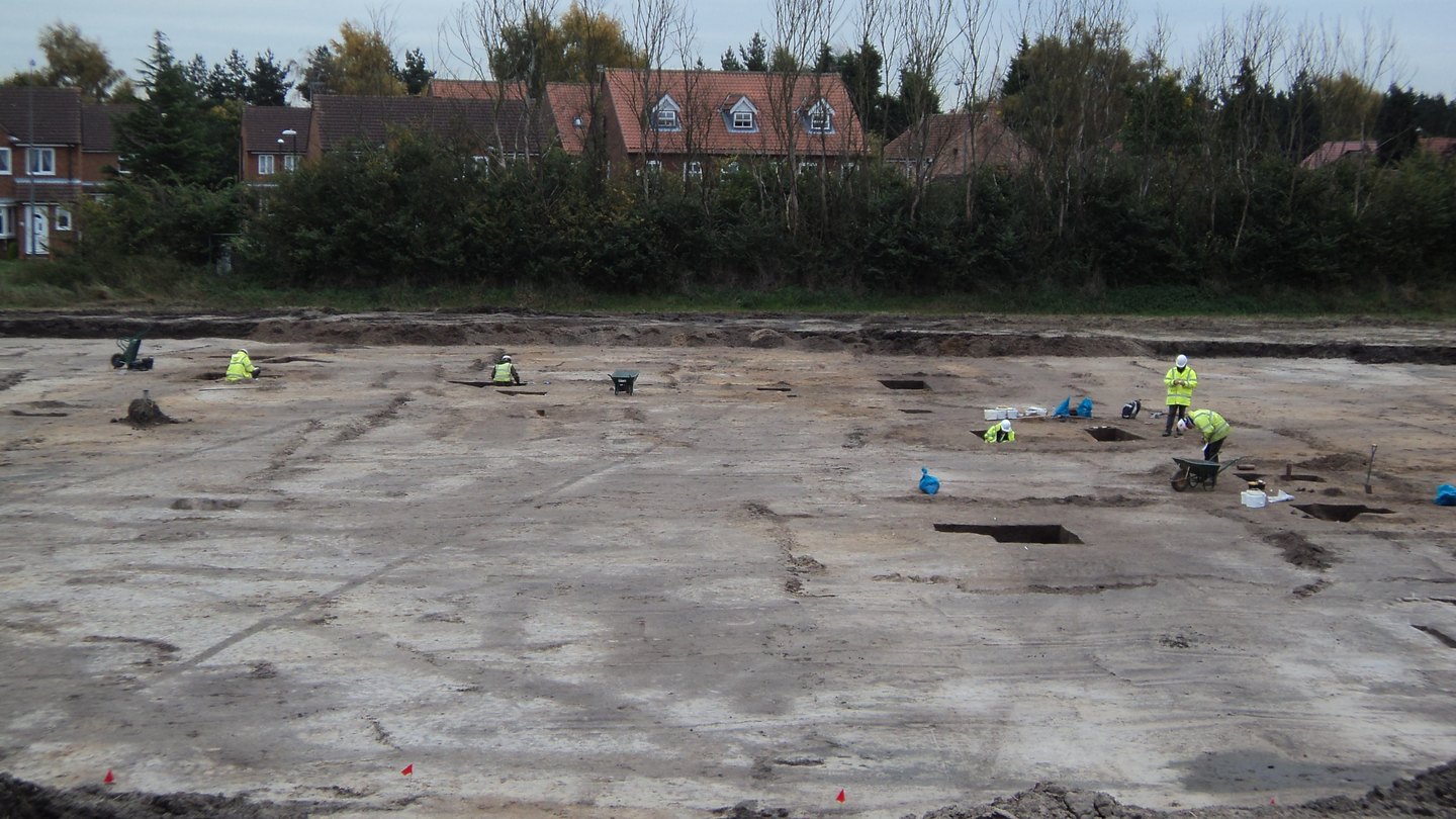 Stripped excavation area under a winter sky